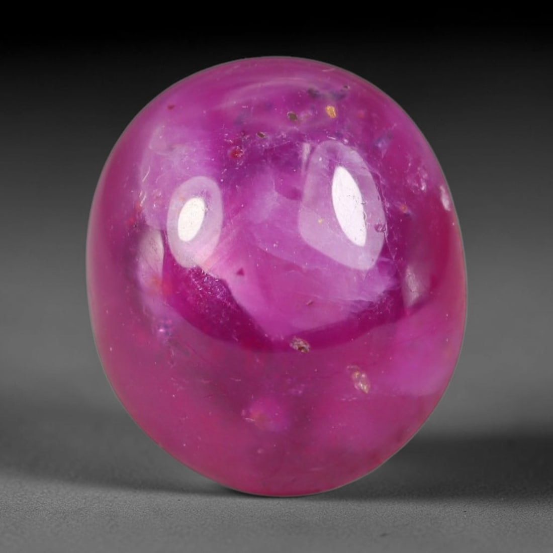 7.66 Carats Natural Madagascar Soft Rose Pink Heated Ruby Cabochon Loose Gemstone, 98AH: This warm blush-toned ruby cabochon carries blended swathes of soft rose pink and gentle peach undertones, with faint natural mineral veining throughout the polished dome, measured at 12.1x10.4x5.6mm.