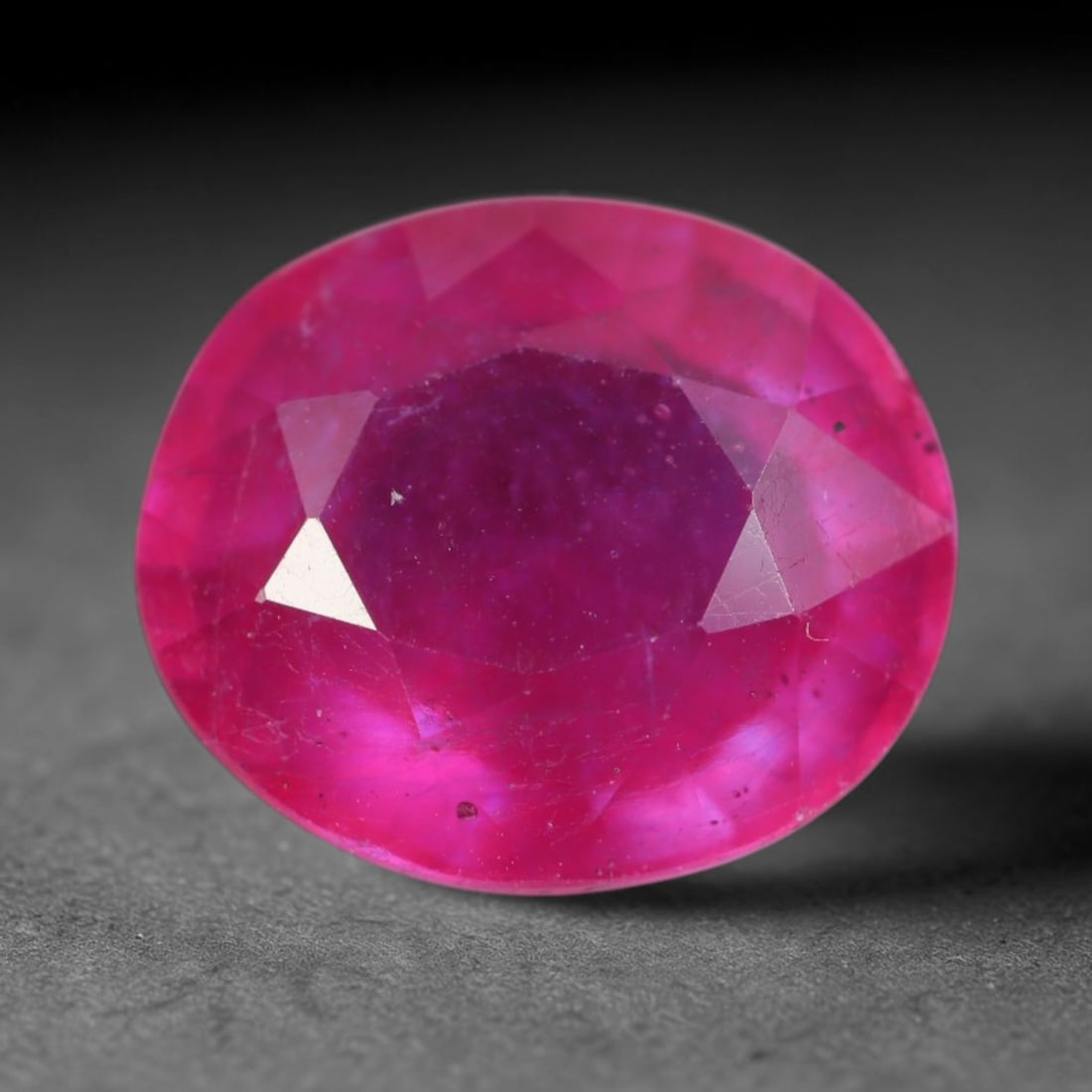5.70 Carats Natural Madagascar Vivid Magenta Red Ruby Loose Gemstone, 56AH: This vivid magenta-hued Madagascar ruby boasts rich saturated red-pink saturation scattered with tiny fine mineral specks and distinct two-phase fluid bubble inclusions throughout its translucent crys