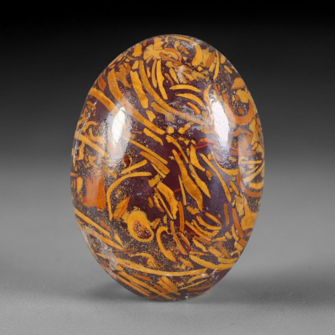 18ct Natural Mariam Jasper (Calligraphy Stone) Cabochon Loose Gemstone, 8AK: This fully polished Mariam Jasper, widely referred to as Calligraphy Stone, features deep plum base matrix interlaced with intricate golden ochre fossilized mineral veining that creates natural brushs