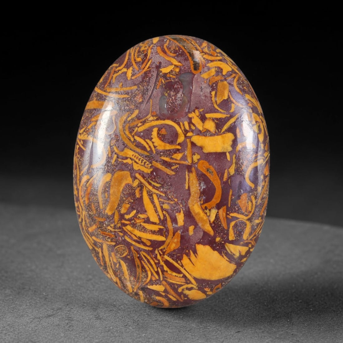 37.67ct Natural Mariam Jasper (Calligraphy Stone) Cabochon Loose Gemstone, 16AK: This fully polished Mariam Jasper, widely referred to as Calligraphy Stone, features deep plum base matrix interlaced with intricate golden ochre fossilized mineral veining that creates natural brushs