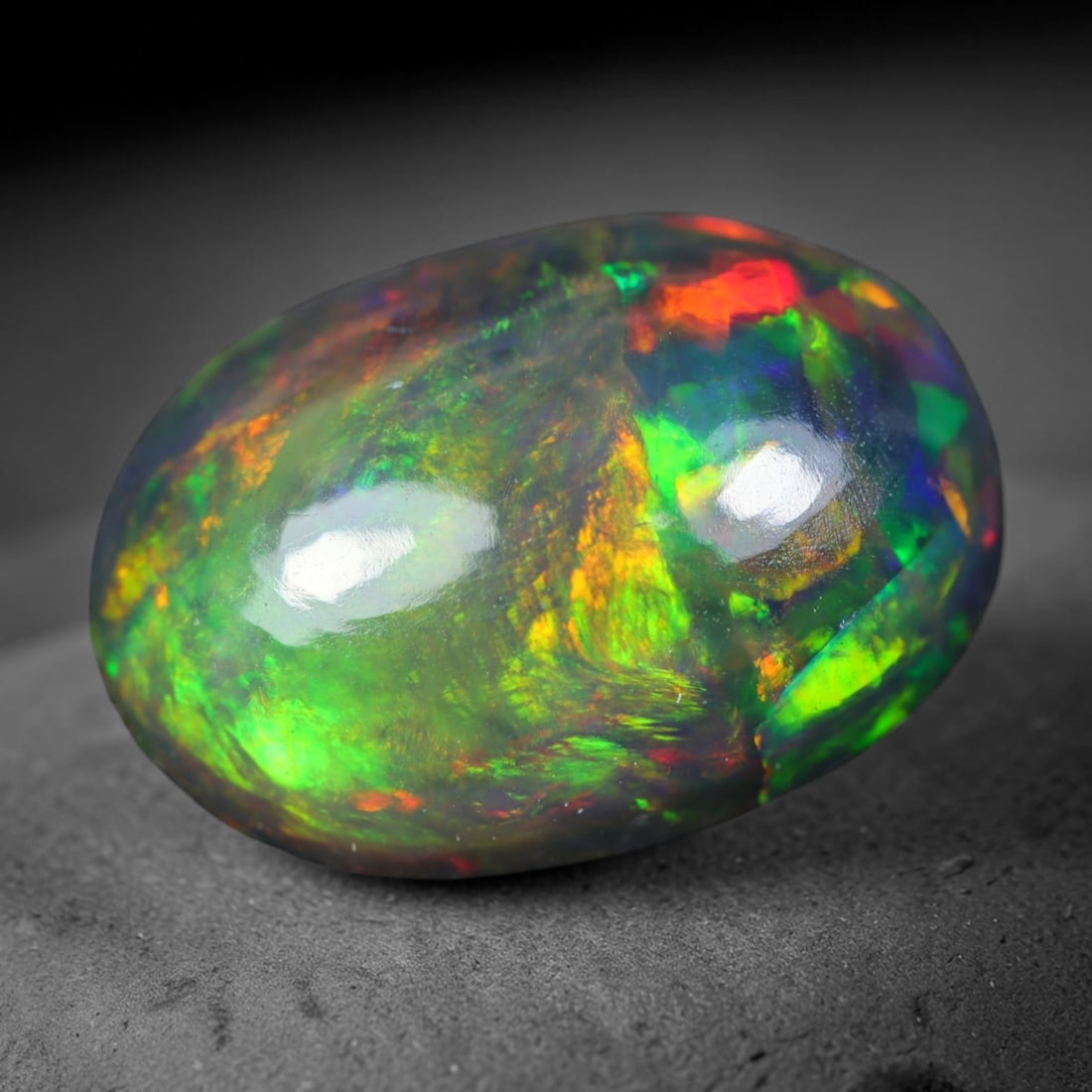 2.82ct Natural Ethiopian Welo Black Smoked Opal Cabochon Loose Gemstone, 72AK: This fully polished Ethiopian Welo opal features a dark smoked base with vivid, sweeping play-of-color shifting across its glossy dome surface, measured at 12.3x8.8x5mm. The black smoke treatment deep