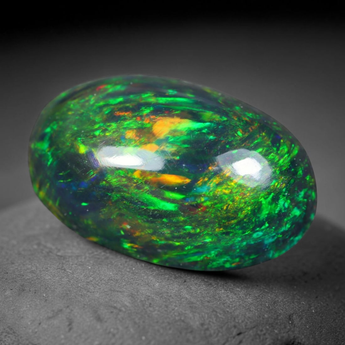 2.84ct Natural Ethiopian Welo Black Smoked Opal Cabochon Loose Gemstone, 65AK: This fully polished Ethiopian Welo opal features a dark smoked base with vivid, sweeping play-of-color shifting across its glossy dome surface, measured at 12.8x8.4x4.2mm. The black smoke treatment de