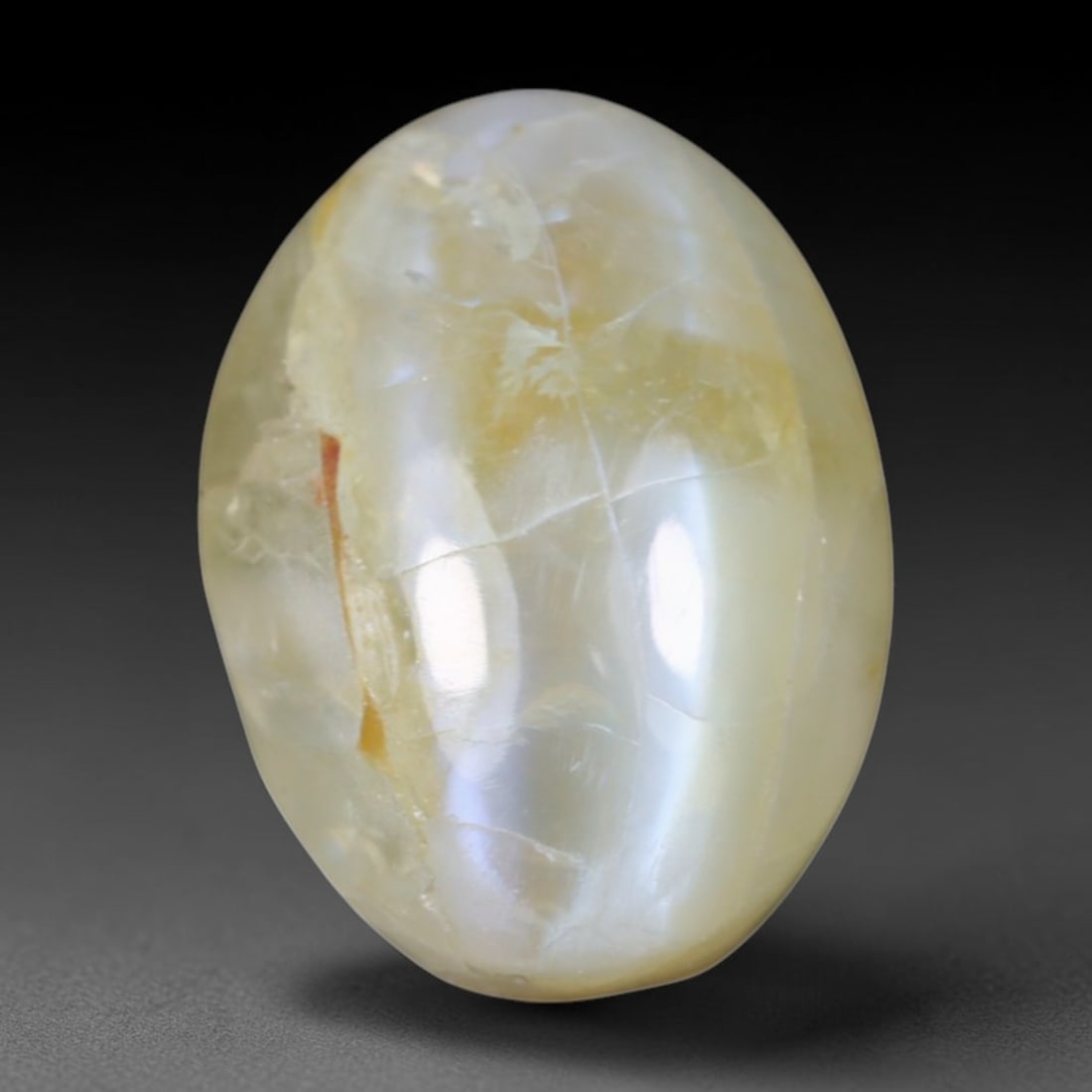 2.17 Carats Natural Ceylon Chrysoberyl Cat's Eye Loose Gemstone, 10AL: This polished Ceylon chrysoberyl cabochon displays a sharp, distinct silvery chatoyant band running across its smooth surface, formed by dense aligned microscopic rutile inclusions inherent to genuine