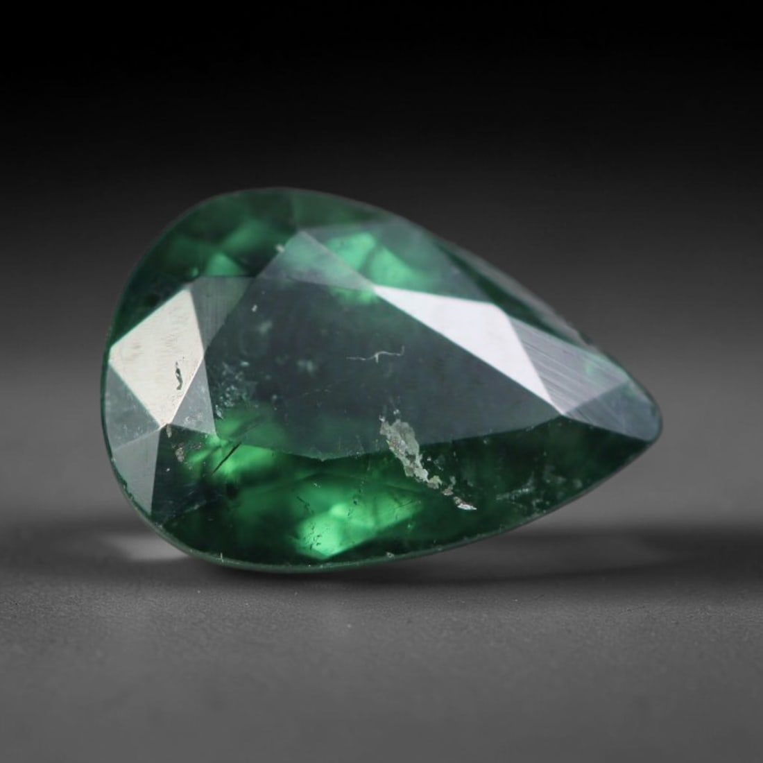 0.90 Carats Natural Mozambique Deep Forest Green Tourmaline Loose Gemstone, 41AK: This transparent Mozambique tourmaline holds a rich saturated deep forest green tone, featuring subtle natural fine fissures and minor mineral surface flecks within the crystal, sized 8x5.5x3.2mm. Moz