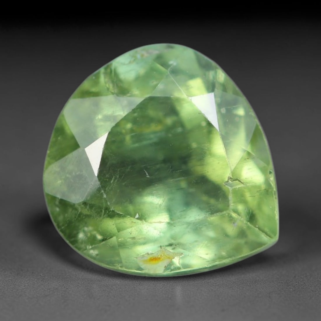 1.64 Carats Natural Mozambique Sage Green Tourmaline Loose Gemstone, 31AK: This transparent Mozambique tourmaline displays a delicate light sage green shade, featuring subtle natural fine fissures and scattered tiny mineral micro-inclusions within its crystal matrix, measure
