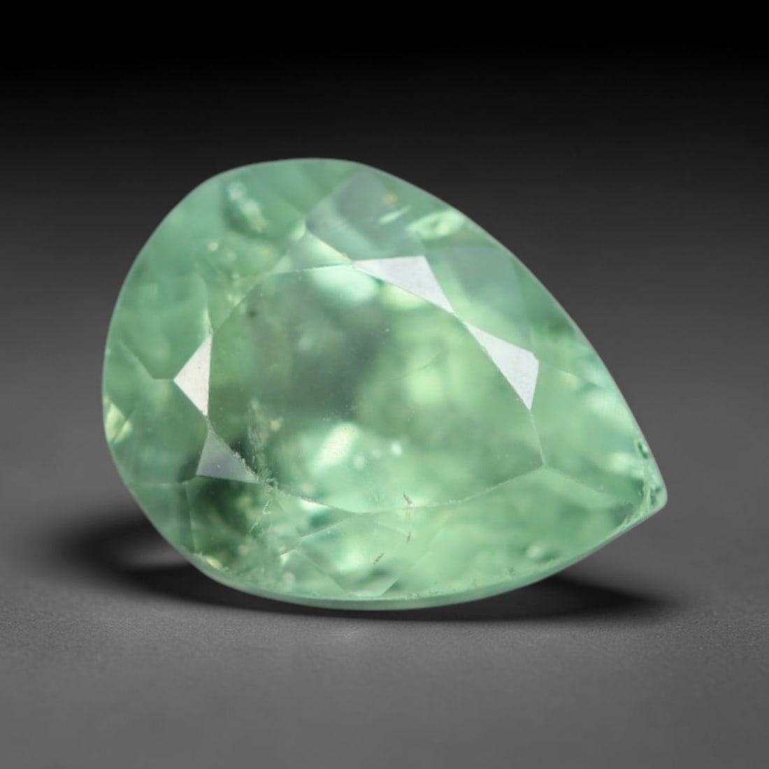 1.33 Carats Natural Mozambique Sage Green Tourmaline Loose Gemstone, 48AK: This transparent Mozambique tourmaline displays a delicate light sage green shade, featuring subtle natural fine fissures and scattered tiny mineral micro-inclusions within its crystal matrix, measure