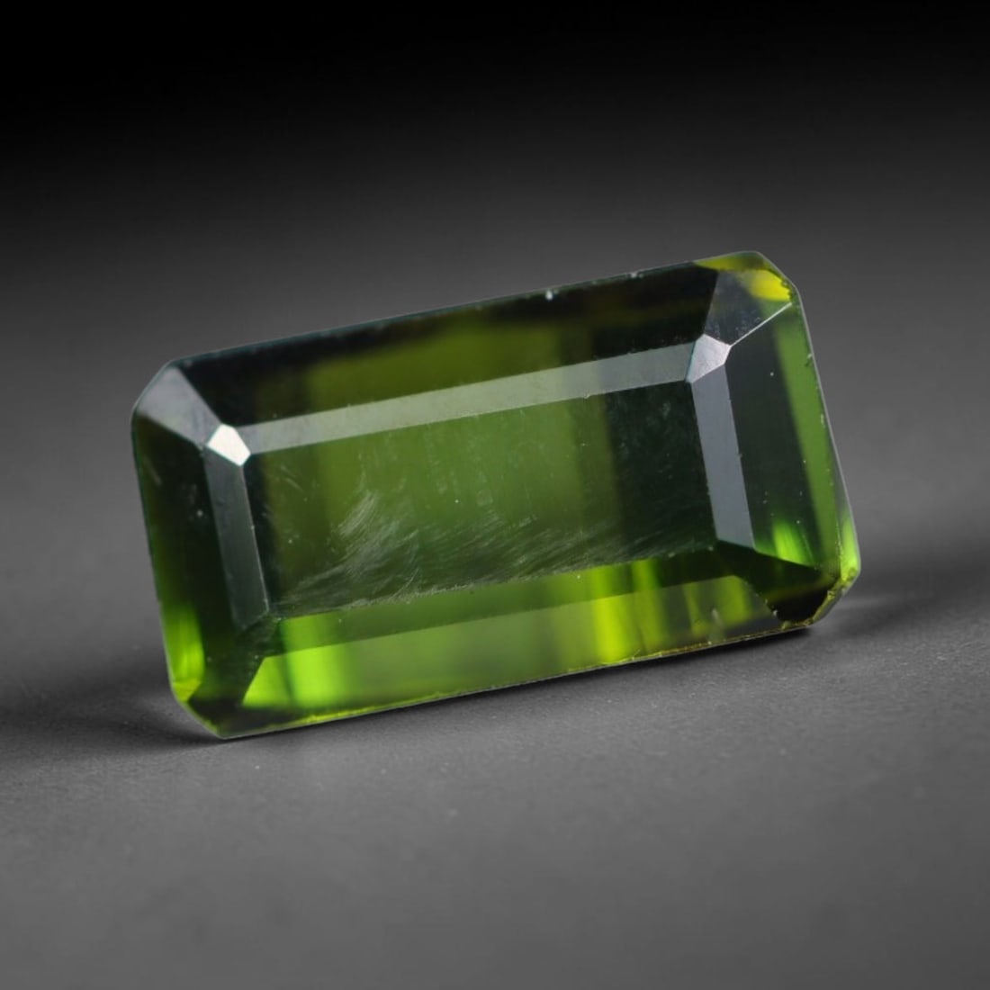 1.73 Carats Natural Mozambique Deep Olive Green Tourmaline Loose Gemstone, 52AK: This transparent Mozambique tourmaline exhibits a rich saturated deep olive green shade, with faint natural internal surface striations and minimal tiny mineral traces within the crystal body, measure