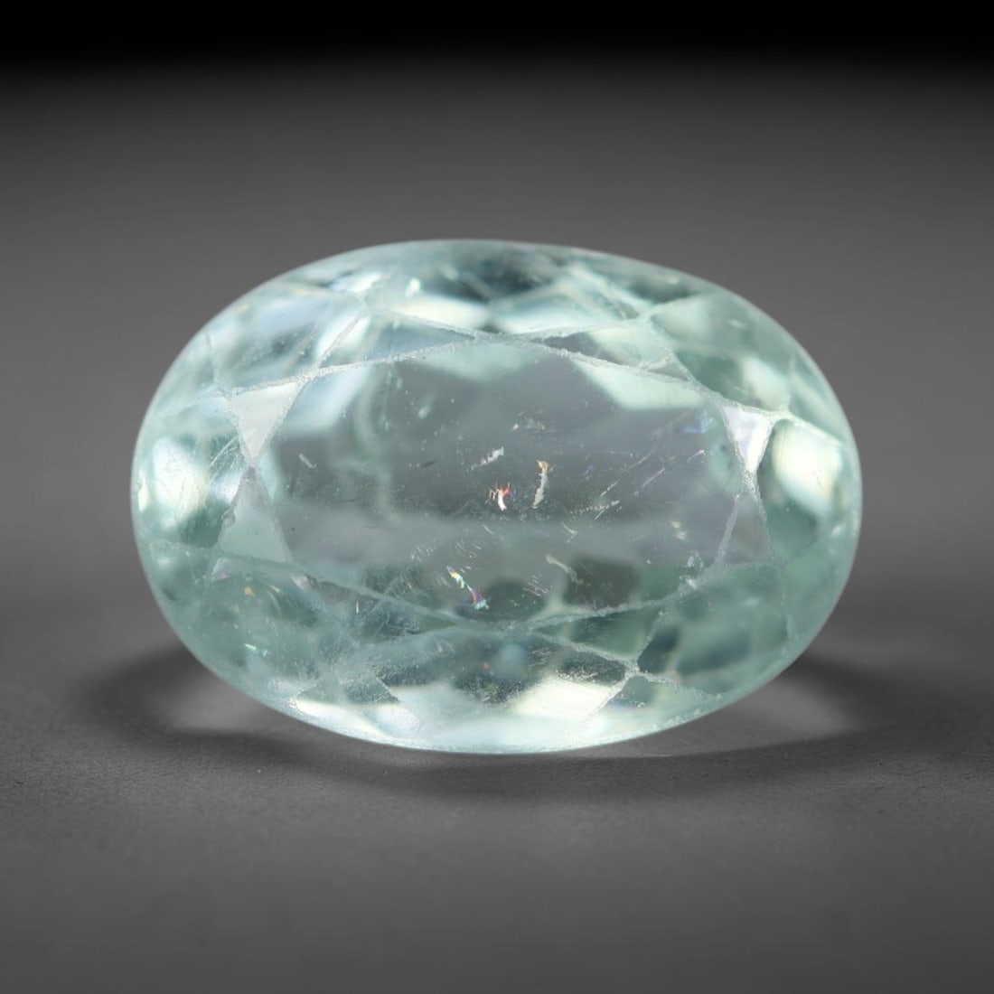 2.33 Carats Natural Mozambique Paraiba Color Tourmaline Loose Gemstone, 22AK: This transparent Mozambique tourmaline boasts vivid Paraiba-toned cool aqua body tone, interspersed with delicate natural internal fissures and tiny reflective mineral flecks throughout the crystal ma
