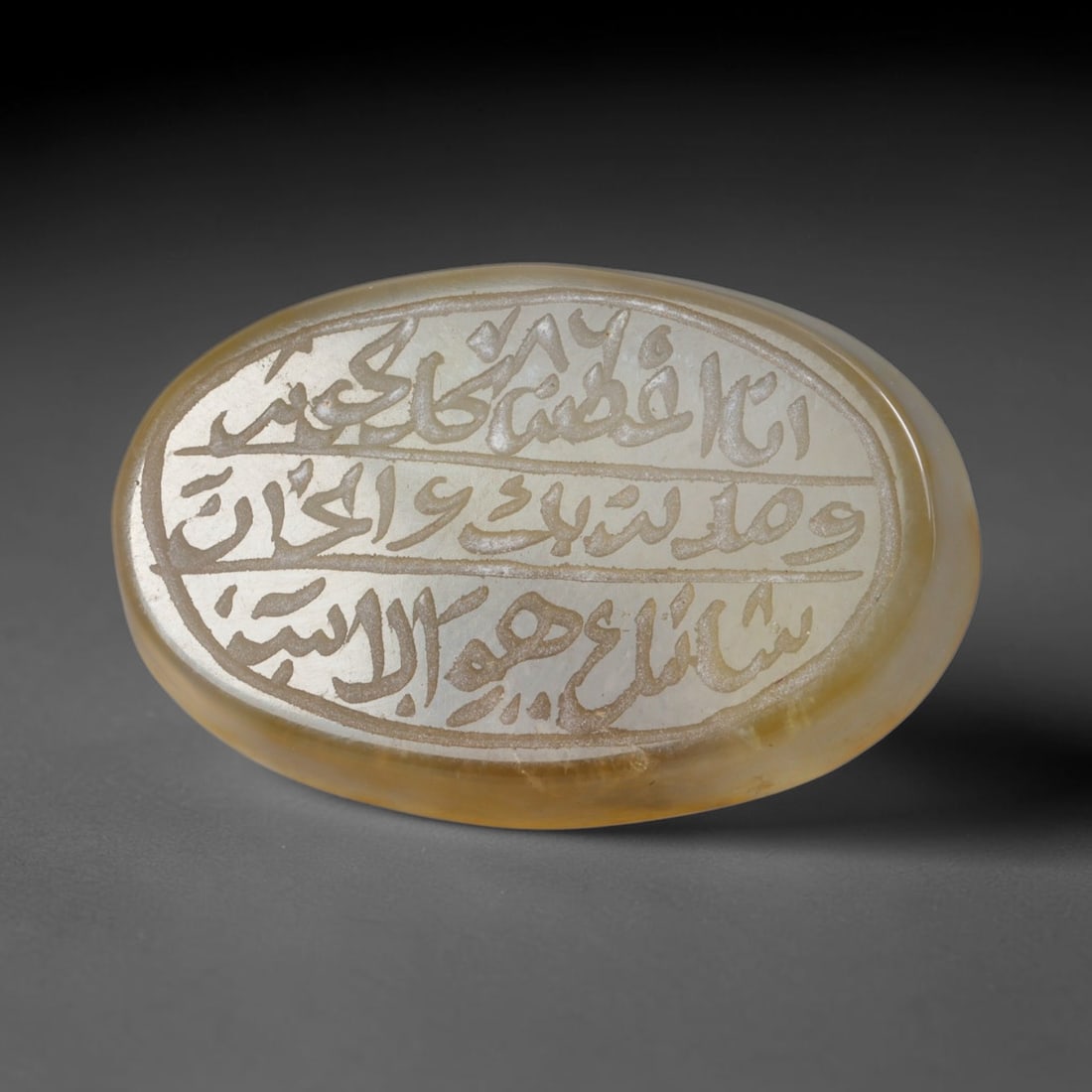 Antique Islamic Qajar / Late Ottoman Agate Calligraphic Talisman Seal (1700-1900 CE), 82AL: Genuine fully hand-carved oval agate seal, entirely crafted by hand without machine tooling, identifiable by organic, uneven hand-cut engraving texture throughout the calligraphic field. The stone bea