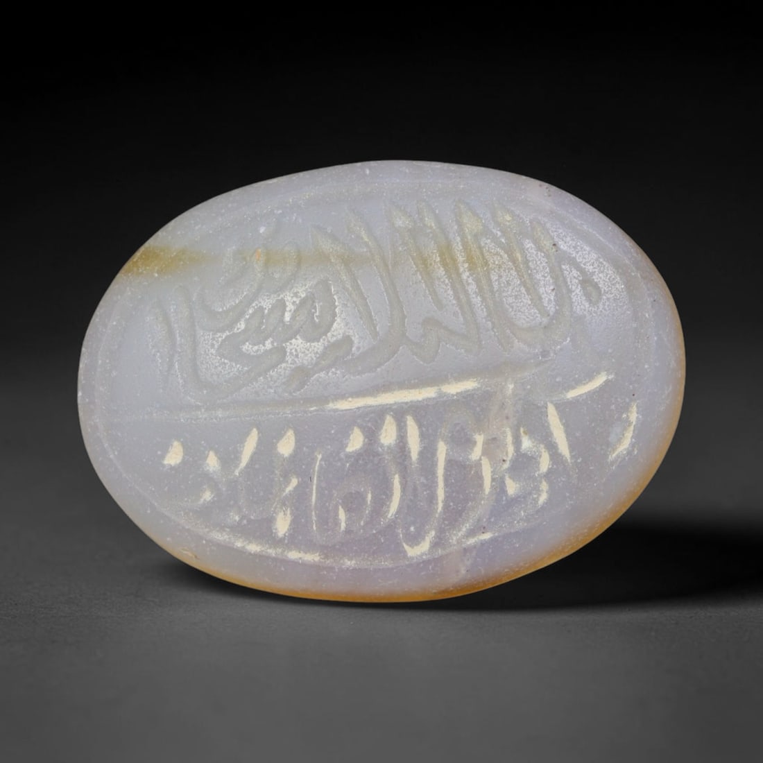 Antique Islamic Qajar / Late Ottoman Agate Calligraphic Talisman Seal (1700-1900 CE), 91AL: Genuine fully hand-carved oval agate seal, entirely crafted by hand without machine tooling, identifiable by organic, uneven hand-cut engraving texture throughout the calligraphic field. The stone bea