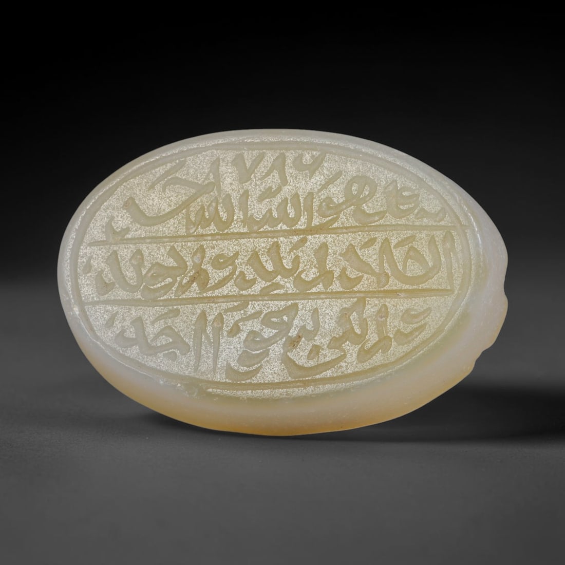 Antique Islamic Qajar / Late Ottoman Agate Calligraphic Talisman Seal (1700-1900 CE), 85AL: Genuine fully hand-carved oval agate seal, entirely crafted by hand without machine tooling, identifiable by organic, uneven hand-cut engraving texture throughout the calligraphic field. The stone bea