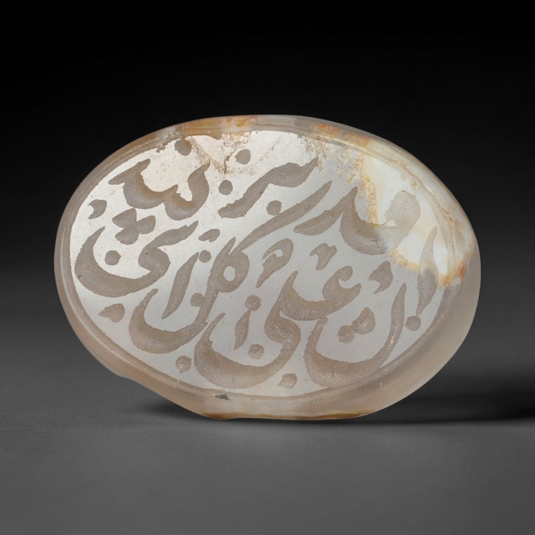 Antique Islamic Qajar / Late Ottoman Agate Calligraphic Talisman Seal (1700-1900 CE), 90AL: Genuine fully hand-carved oval agate seal, entirely crafted by hand without machine tooling, identifiable by organic, uneven hand-cut engraving texture throughout the calligraphic field. The stone bea