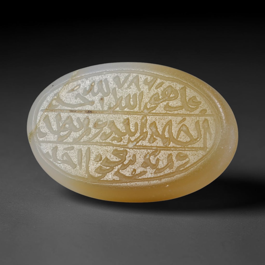 Antique Islamic Qajar / Late Ottoman Agate Calligraphic Talisman Seal (1700-1900 CE), 83AL: Genuine fully hand-carved oval agate seal, entirely crafted by hand without machine tooling, identifiable by organic, uneven hand-cut engraving texture throughout the calligraphic field. The stone bea