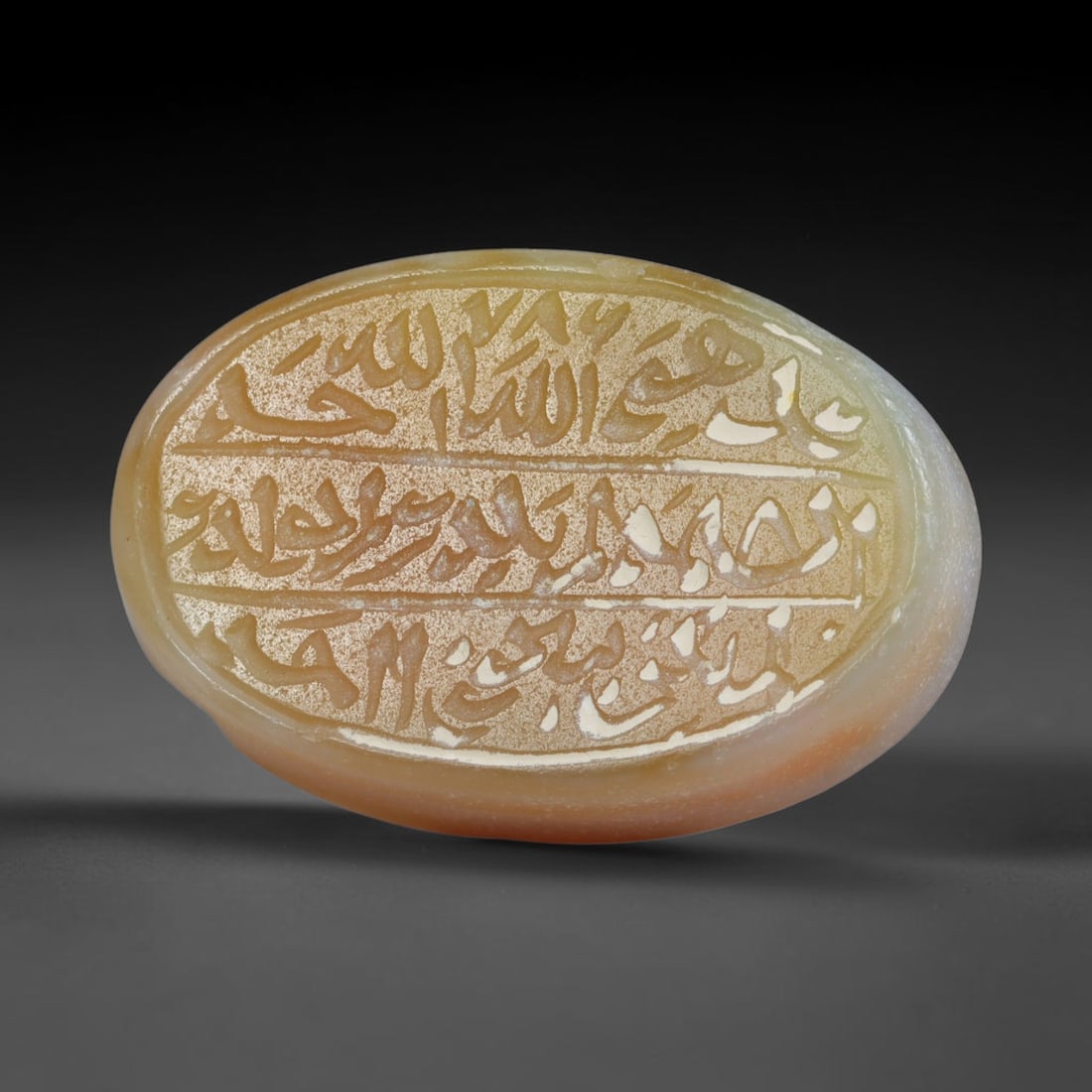 Antique Islamic Qajar / Late Ottoman Agate Calligraphic Talisman Seal (1700-1900 CE), 74AL: Genuine fully hand-carved oval agate seal, entirely crafted by hand without machine tooling, identifiable by organic, uneven hand-cut engraving texture throughout the calligraphic field. The stone bea