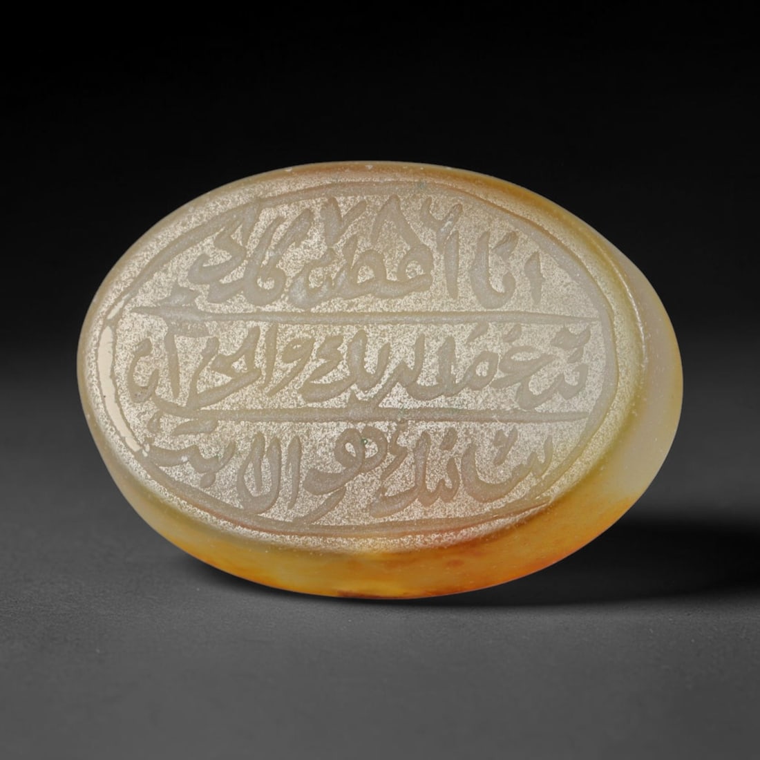 Antique Islamic Qajar / Late Ottoman Agate Calligraphic Talisman Seal (1700-1900 CE), 88AL: Genuine fully hand-carved oval agate seal, entirely crafted by hand without machine tooling, identifiable by organic, uneven hand-cut engraving texture throughout the calligraphic field. The stone bea