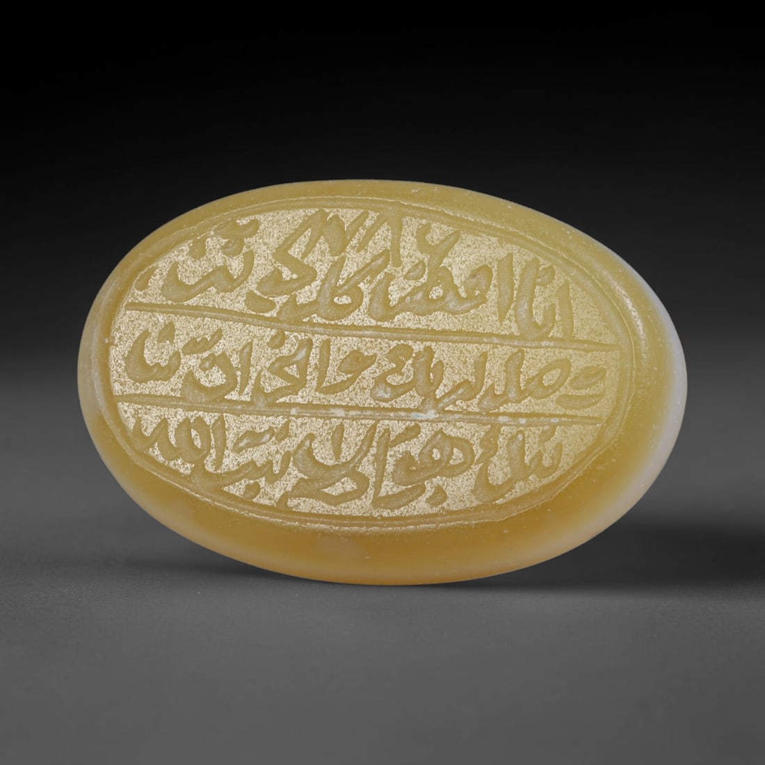 Antique Islamic Qajar / Late Ottoman Agate Calligraphic Talisman Seal (1700-1900 CE), 77AL: Genuine fully hand-carved oval agate seal, entirely crafted by hand without machine tooling, identifiable by organic, uneven hand-cut engraving texture throughout the calligraphic field. The stone bea