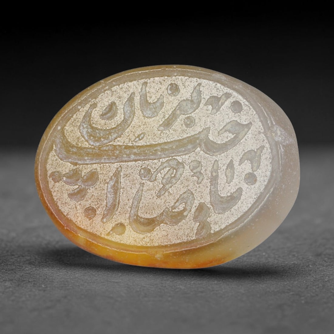 Antique Islamic Qajar / Late Ottoman Agate Calligraphic Talisman Seal (1700-1900 CE), 96AL: Genuine fully hand-carved oval agate seal, entirely crafted by hand without machine tooling, identifiable by organic, uneven hand-cut engraving texture throughout the calligraphic field. The stone bea