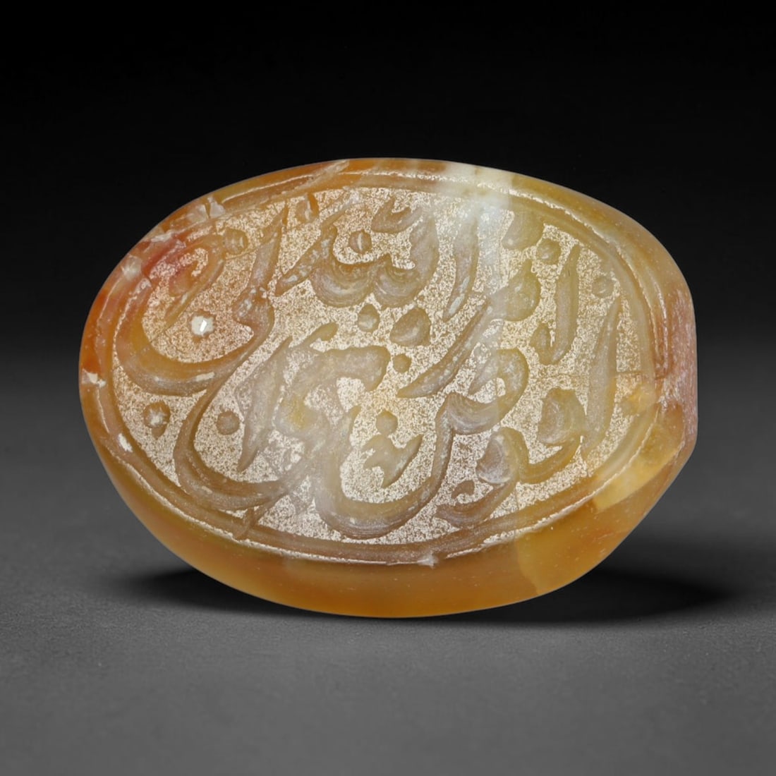 Antique Islamic Qajar / Late Ottoman Agate Calligraphic Talisman Seal (1700-1900 CE), 98AL: Genuine fully hand-carved oval agate seal, entirely crafted by hand without machine tooling, identifiable by organic, uneven hand-cut engraving texture throughout the calligraphic field. The stone bea