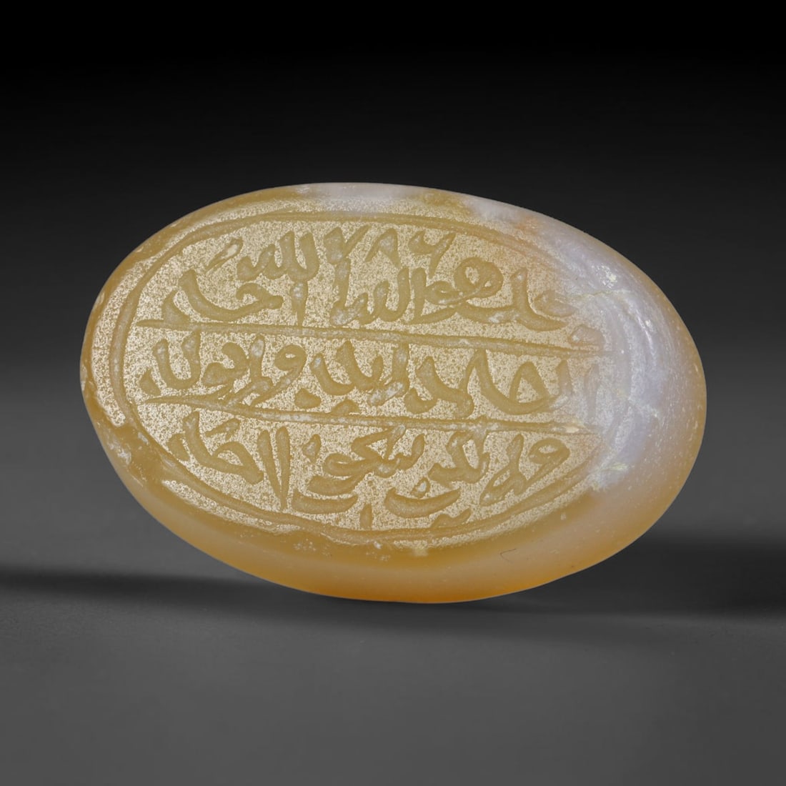 Antique Islamic Qajar / Late Ottoman Agate Calligraphic Talisman Seal (1700-1900 CE), 76AL: Genuine fully hand-carved oval agate seal, entirely crafted by hand without machine tooling, identifiable by organic, uneven hand-cut engraving texture throughout the calligraphic field. The stone bea