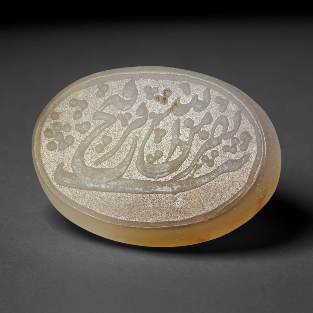 Antique Islamic Qajar / Late Ottoman Agate Calligraphic Talisman Seal (1700-1900 CE), 99AL: Genuine fully hand-carved oval agate seal, entirely crafted by hand without machine tooling, identifiable by organic, uneven hand-cut engraving texture throughout the calligraphic field. The stone bea