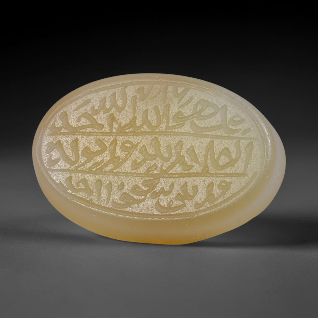 Antique Islamic Qajar / Late Ottoman Agate Calligraphic Talisman Seal (1700-1900 CE), 73AL: Genuine fully hand-carved oval agate seal, entirely crafted by hand without machine tooling, identifiable by organic, uneven hand-cut engraving texture throughout the calligraphic field. The stone bea