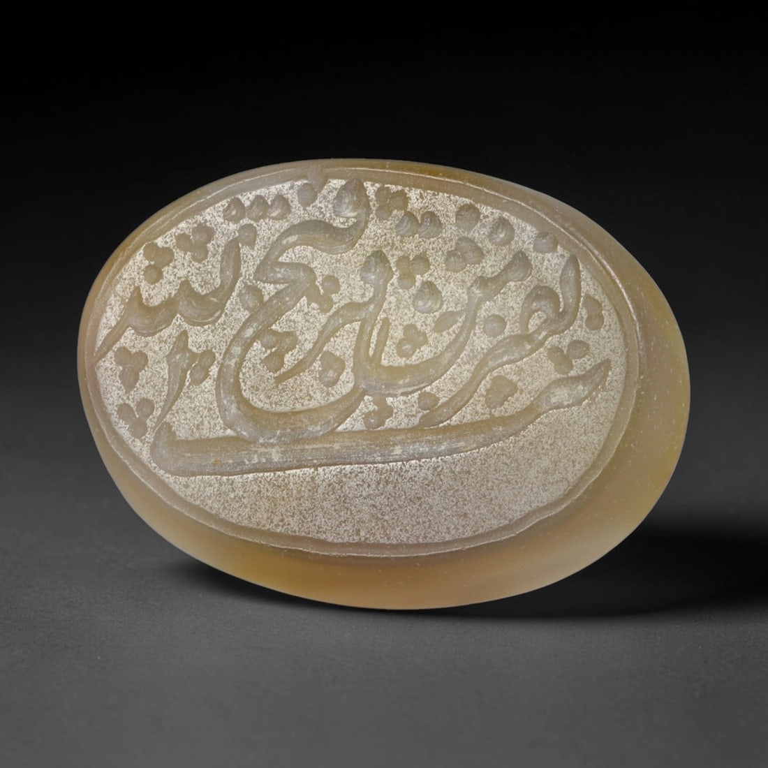 Antique Islamic Qajar / Late Ottoman Agate Calligraphic Talisman Seal (1700-1900 CE), 75AL: Genuine fully hand-carved oval agate seal, entirely crafted by hand without machine tooling, identifiable by organic, uneven hand-cut engraving texture throughout the calligraphic field. The stone bea