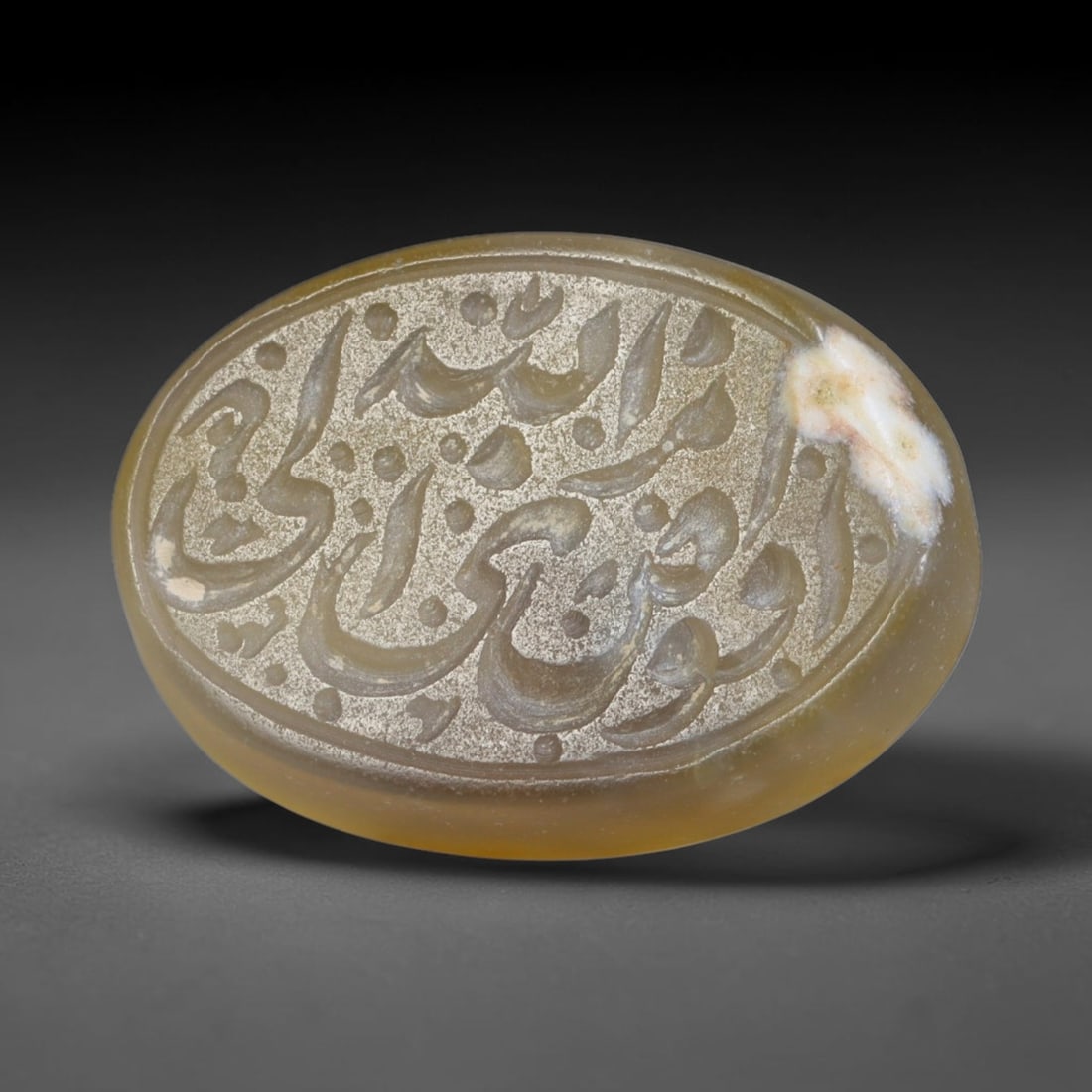 Antique Islamic Qajar / Late Ottoman Agate Calligraphic Talisman Seal (1700-1900 CE), 86AL: Genuine fully hand-carved oval agate seal, entirely crafted by hand without machine tooling, identifiable by organic, uneven hand-cut engraving texture throughout the calligraphic field. The stone bea