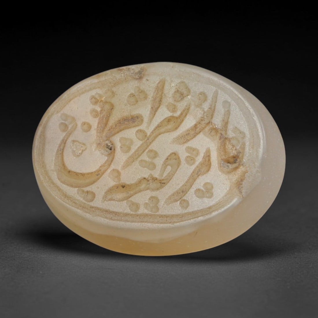 Antique Islamic Qajar / Late Ottoman Agate Calligraphic Talisman Seal (1700-1900 CE), 4AM: Genuine fully hand-carved oval agate seal, entirely crafted by hand without machine tooling, identifiable by organic, uneven hand-cut engraving texture throughout the calligraphic field. The stone bea