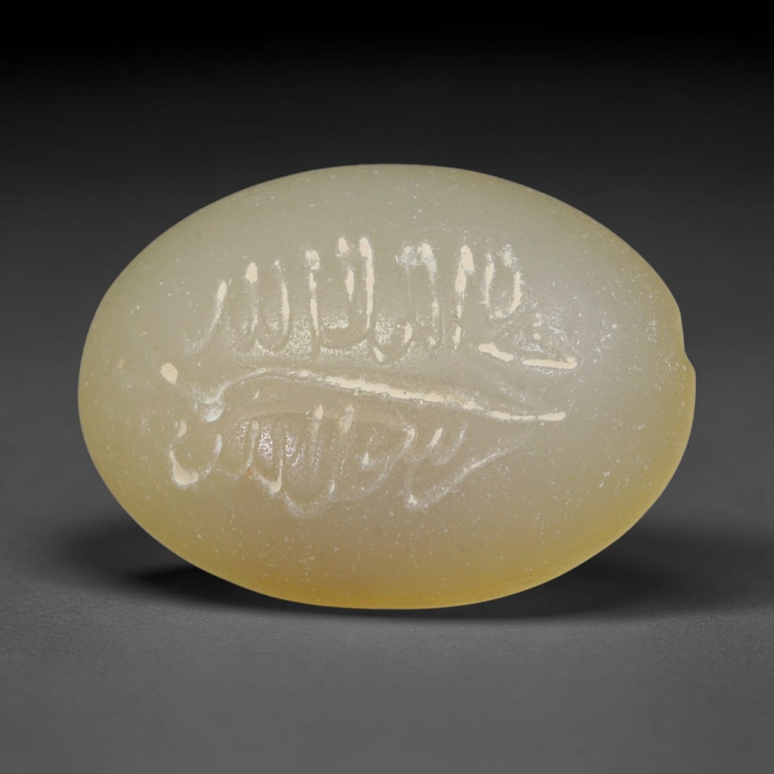 Antique Islamic Qajar / Late Ottoman Agate Calligraphic Talisman Seal (1700-1900 CE), 8AM: Genuine fully hand-carved oval agate seal, entirely crafted by hand without machine tooling, identifiable by organic, uneven hand-cut engraving texture throughout the calligraphic field. The stone bea