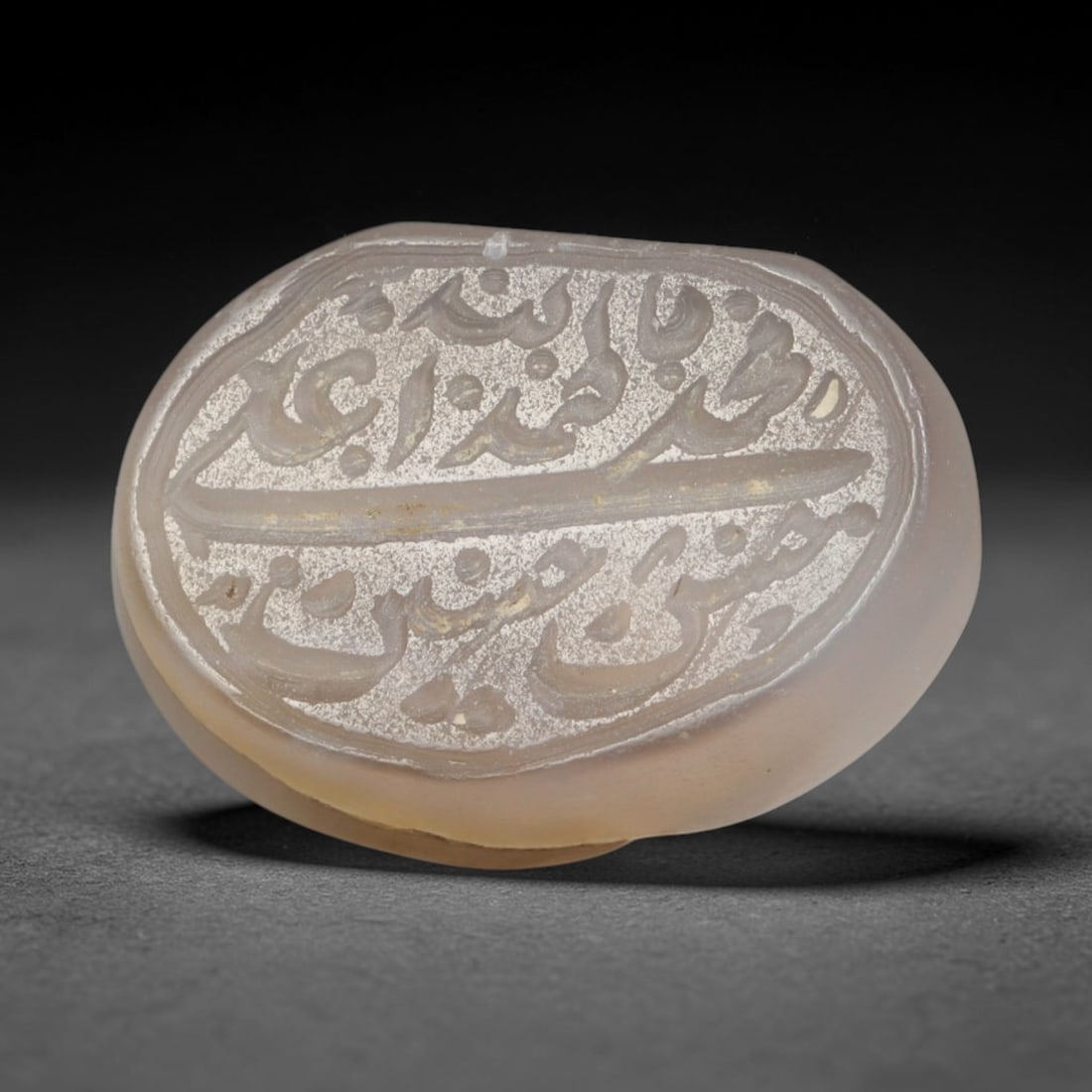 Antique Islamic Qajar / Late Ottoman Agate Calligraphic Talisman Seal (1700-1900 CE), 3AM: Genuine fully hand-carved oval agate seal, entirely crafted by hand without machine tooling, identifiable by organic, uneven hand-cut engraving texture throughout the calligraphic field. The stone bea