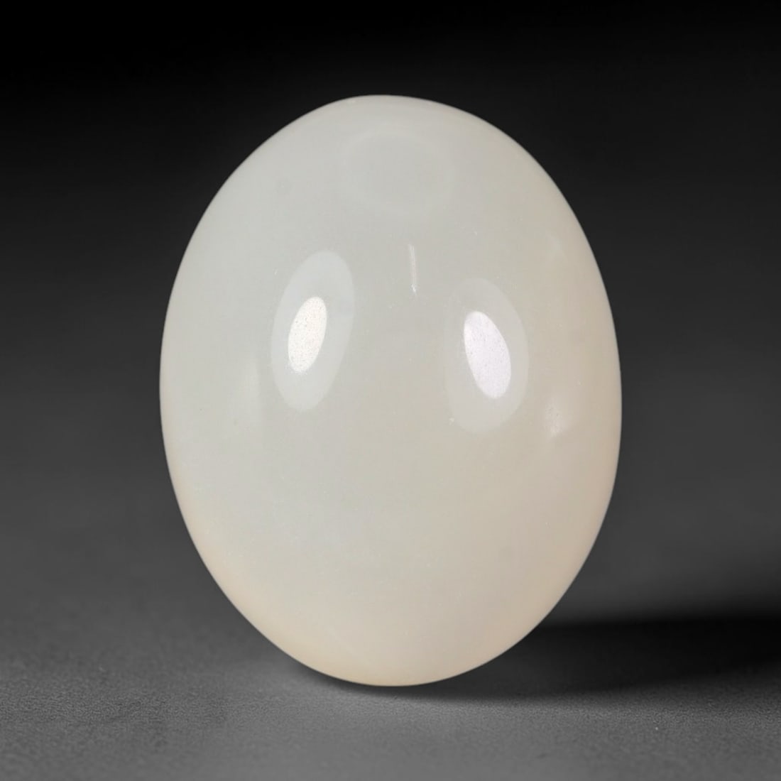 19.17 Carats Natural Ceylon Soft Milky White Moonstone Loose Gemstone, 70FE: This natural Ceylon moonstone carries a smooth milky white base with subtle gentle adularescent glow across its polished surface, measured at 19.2x14.9x9.2mm, showcasing clean even transparency with m
