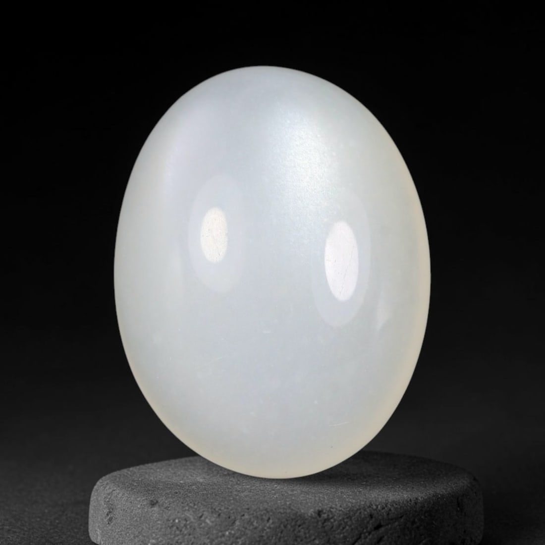 13.69 Carats Natural Ceylon Soft Milky White Moonstone Loose Gemstone, 62FE: This natural Ceylon moonstone carries a smooth milky white base with subtle gentle adularescent glow across its polished surface, measured at 18.8x14.4x7mm, showcasing clean even transparency with min