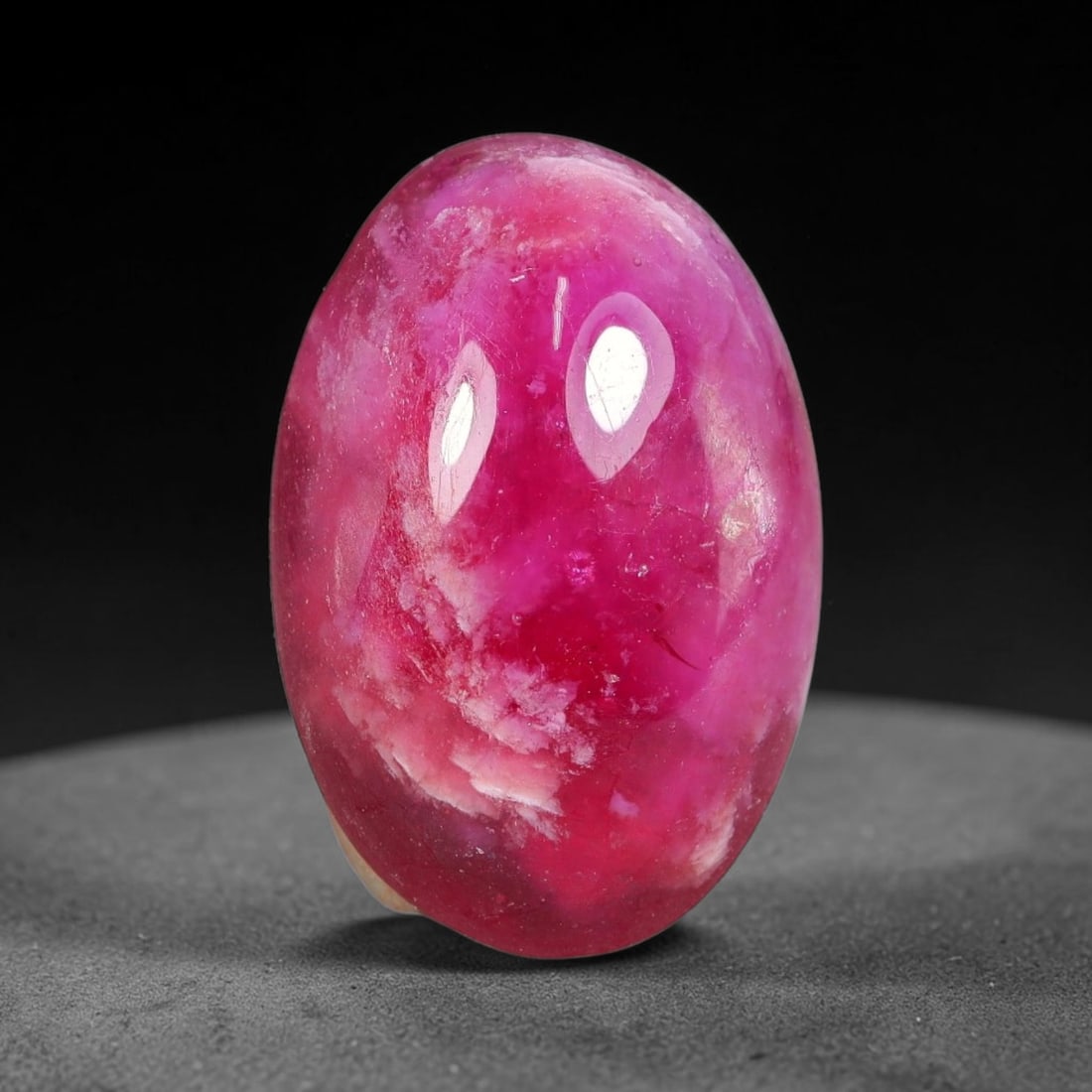 15.04 Carats Natural Mozambique Vivid Pink Red Ruby Loose Gemstone, 95FG: This polished Mozambique ruby cabochon measures 18.5x12.7x6.7mm, featuring striking natural swirling white mineral banding layered across a rich saturated pink red base that creates a unique organic a
