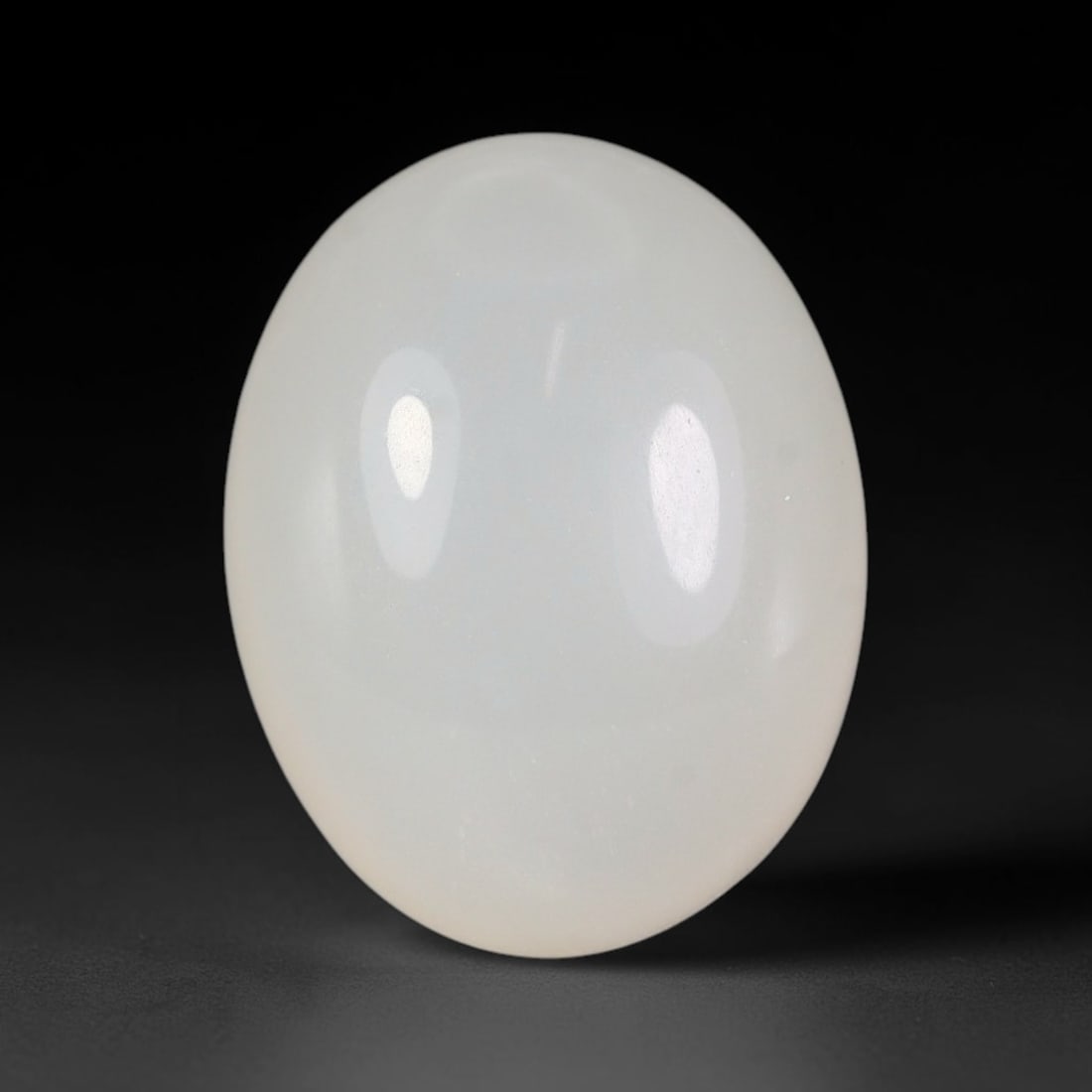 16 Carats Natural Ceylon Soft Milky White Moonstone Loose Gemstone, 65FE: This natural Ceylon moonstone carries a smooth milky white base with subtle gentle adularescent glow across its polished surface, measured at 18x14x3.8mm, showcasing clean even transparency with minim