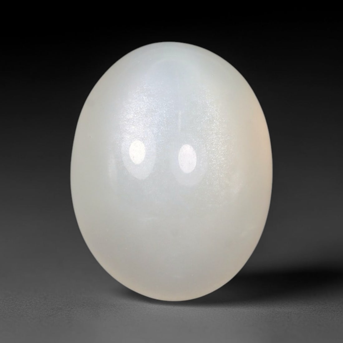 14.52 Carats Natural Ceylon Soft Milky White Moonstone Loose Gemstone, 72FE: This natural Ceylon moonstone carries a smooth milky white base with subtle gentle adularescent glow across its polished surface, measured at 16.2x12.6x9.4mm, showcasing clean even transparency with m