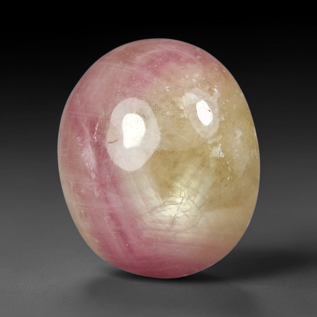 11.85 Carats Natural Madagascar Soft Rose Pink Heated Ruby Cabochon Loose Gemstone, 51FE: This warm blush-toned ruby cabochon carries blended swathes of soft rose pink and gentle peach undertones, with faint natural mineral veining throughout the polished dome, measured at 14.2x12x6.6mm. T