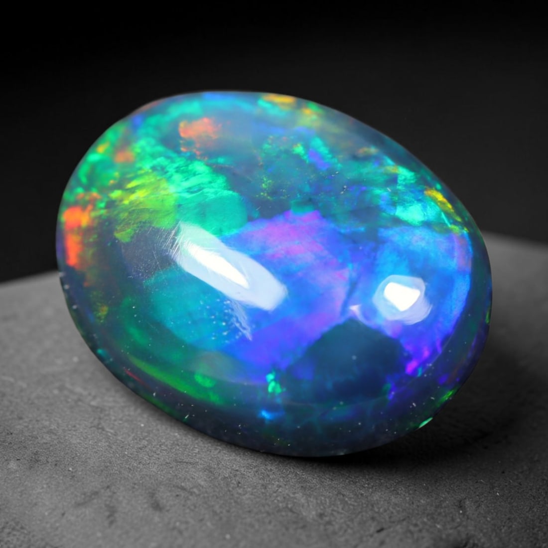 1.67ct Natural Ethiopian Welo Black Smoked Opal Cabochon Loose Gemstone, 30FL: This fully polished Ethiopian Welo opal features a dark smoked base with vivid, sweeping play-of-color shifting across its glossy dome surface, measured at 10.3x8.1x4mm. The black smoke treatment deep