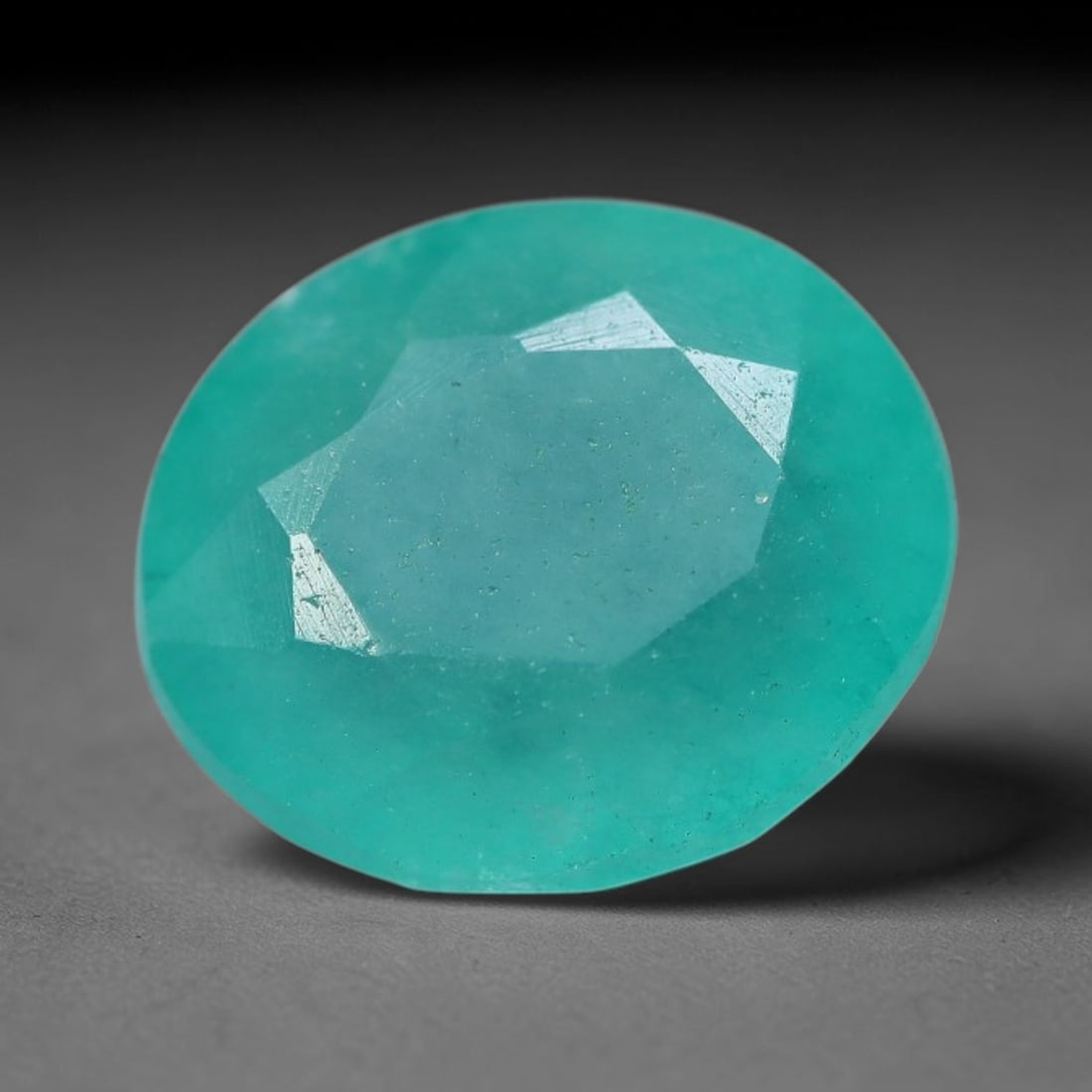 5.32 Carats Natural Brazilian Soft Mint Green Beryl Loose Gemstone, 96FE: This natural Brazilian green beryl measures 11.3x9.8x7mm, presenting a soft uniform mint green tone throughout its translucent crystal matrix, dotted with fine scattered dark mineral specks and subtle
