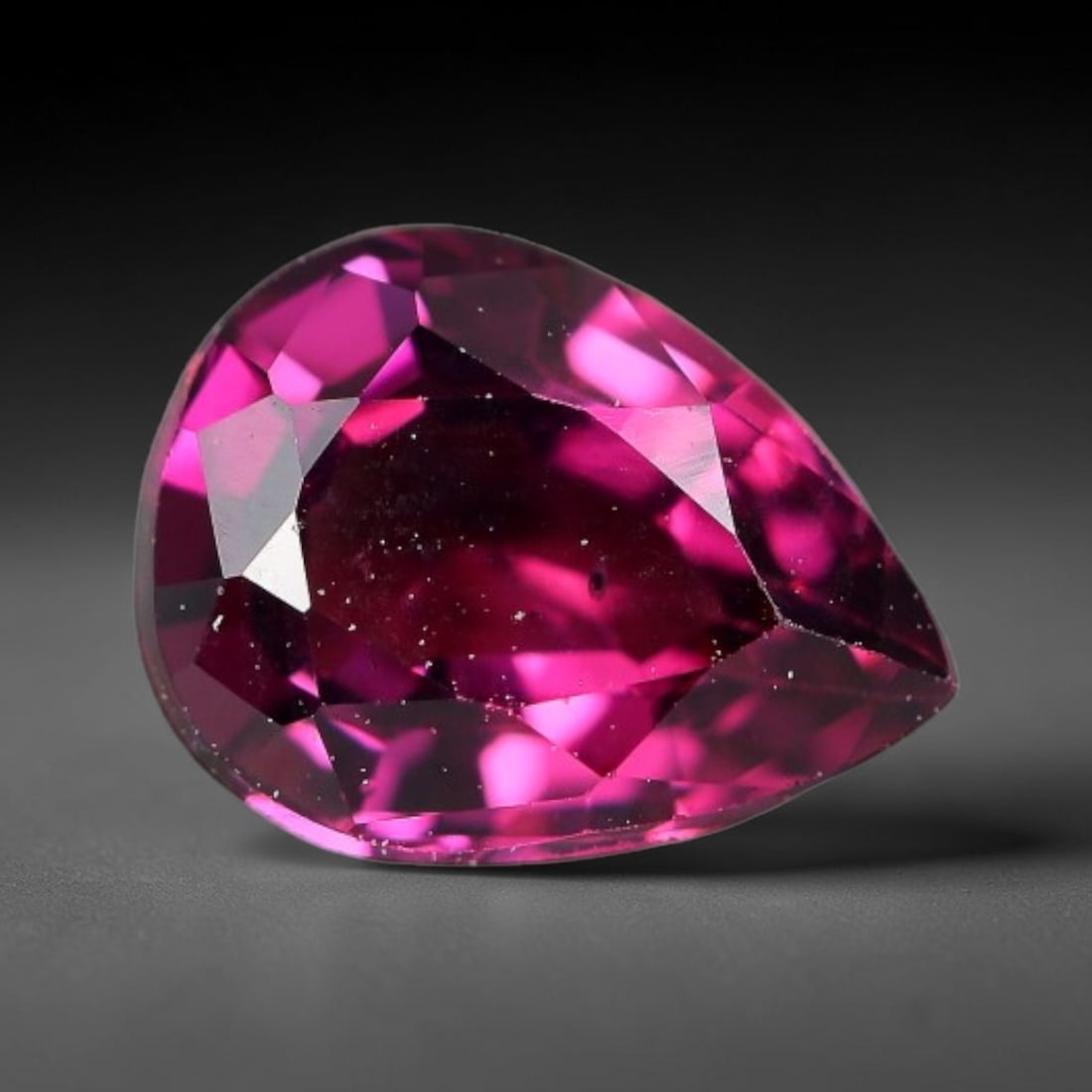 1.61 Carats Natural Mozambique Rich Raspberry Rhodolite Garnet Loose Gemstone, 69FM: This natural Mozambique rhodolite garnet holds dimension measurements of 8.2x6.2x3.9mm, carrying an intense saturated raspberry red hue that radiates vivid tonal flashes through its transparent crysta
