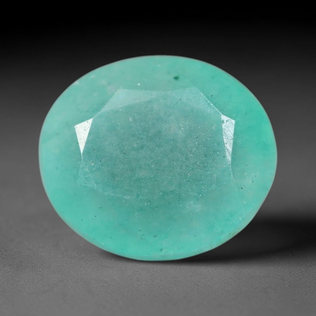 5.43 Carats Natural Brazilian Soft Mint Green Beryl Loose Gemstone, 1FE: This natural Brazilian green beryl measures 11.3x9.8x6.7mm, presenting a soft uniform mint green tone throughout its translucent crystal matrix, dotted with fine scattered dark mineral specks and subt