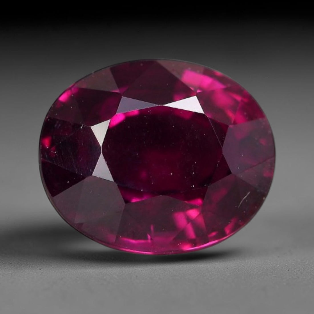 4.03 Carats Natural Mozambique Deep Fuchsia Rhodolite Garnet Loose Gemstone, 72FM: This natural Mozambique rhodolite garnet features dimensions of 10x8.3x5.4mm, holding a vivid deep fuchsia-pink color that glows brightly when light passes through its transparent body, with fine subt