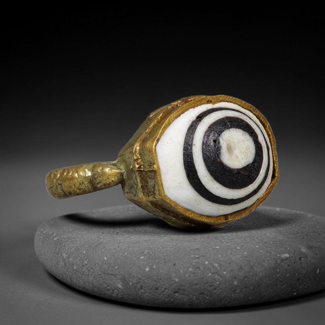 Antique Qajar Dynasty Copper Alloy Ring Set With Banded Glass Bead Cabochon, 57AC, 57AC: Historic wearable signet ring crafted from textured copper alloy metal, sized to US ring size 9, originating from Qajar Persian artistic and adornment traditions of late medieval Iran. Copper alloy wa