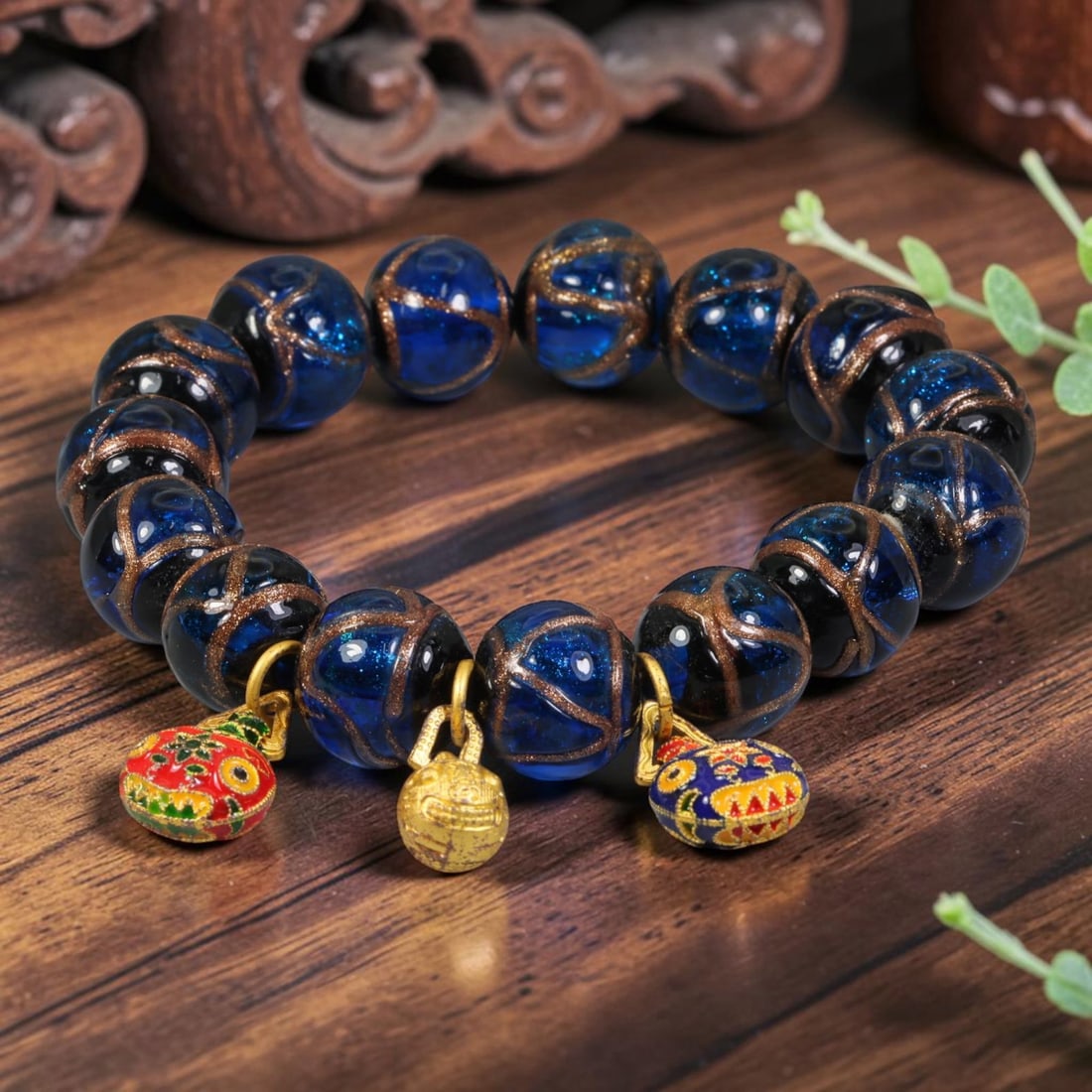 A Chinese Glass Beaded Bracelet - Blue Gold Sand Glass Charm Strand, 10AP, 10AP: Hand-strand bracelet composed of round 14mm hand-blown Chinese glass beads, each crafted with translucent deep blue glass infused with fine gold aventurine sand, detailed with hand-painted bronze tone