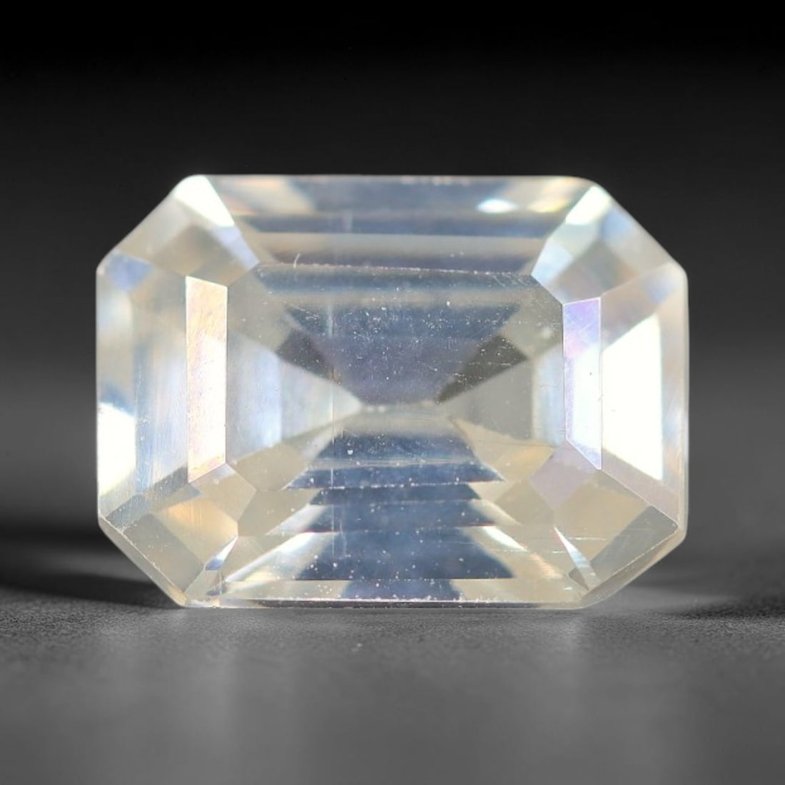 1.44 Carats Natural Cool White Moissanite Loose Gemstone, 86FM: This cool white moissanite holds dimension measurements of 8.1x6x3.5mm, delivering exceptional light dispersion that generates vivid rainbow sparkle across its fully transparent body, with faint micro