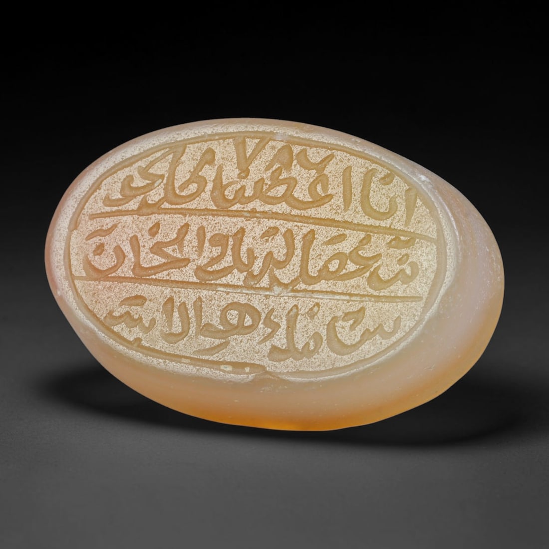 Antique Islamic Qajar / Late Ottoman Agate Calligraphic Talisman Seal (1700-1900 CE), 97FP: Genuine fully hand-carved oval agate seal, entirely crafted by hand without machine tooling, identifiable by organic, uneven hand-cut engraving texture throughout the calligraphic field. The stone bea