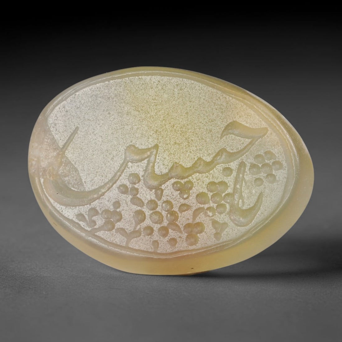 Antique Islamic Qajar / Late Ottoman Agate Calligraphic Talisman Seal (1700-1900 CE), 89FP: Genuine fully hand-carved oval agate seal, entirely crafted by hand without machine tooling, identifiable by organic, uneven hand-cut engraving texture throughout the calligraphic field. The stone bea