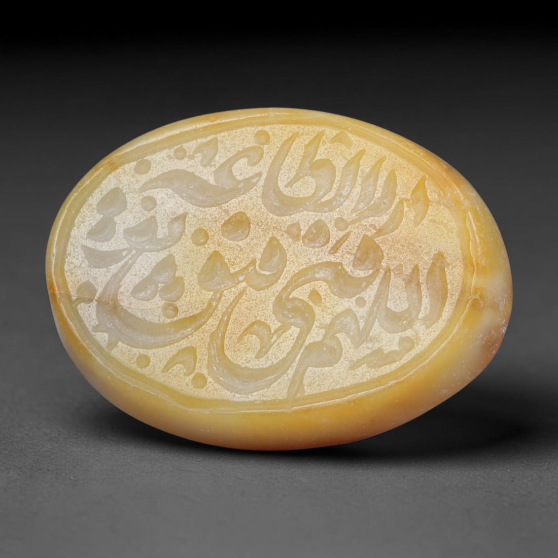 Antique Islamic Qajar / Late Ottoman Agate Calligraphic Talisman Seal (1700-1900 CE), 68FP: Genuine fully hand-carved oval agate seal, entirely crafted by hand without machine tooling, identifiable by organic, uneven hand-cut engraving texture throughout the calligraphic field. The stone bea