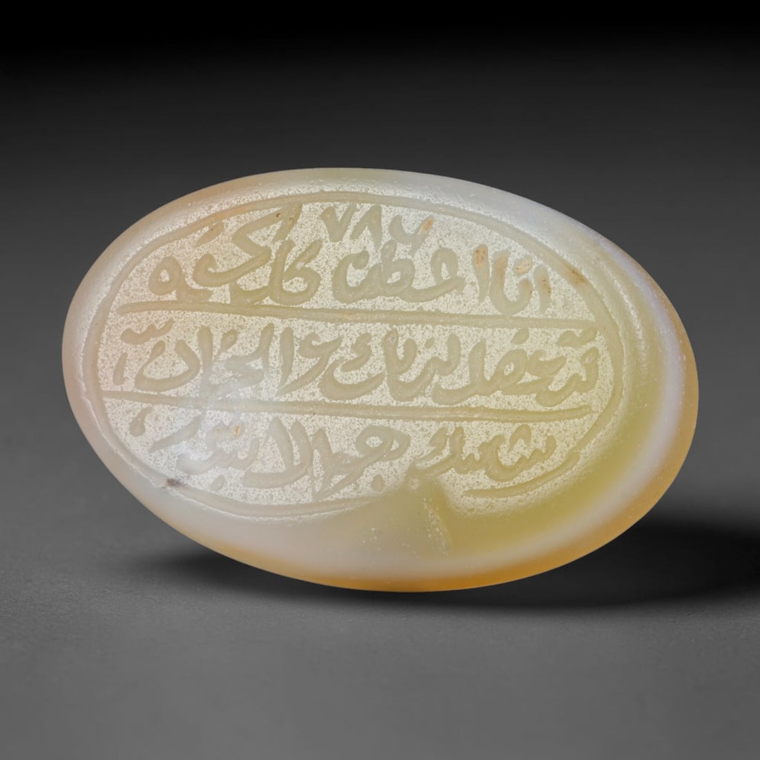 Antique Islamic Qajar / Late Ottoman Agate Calligraphic Talisman Seal (1700-1900 CE), 78FP: Genuine fully hand-carved oval agate seal, entirely crafted by hand without machine tooling, identifiable by organic, uneven hand-cut engraving texture throughout the calligraphic field. The stone bea