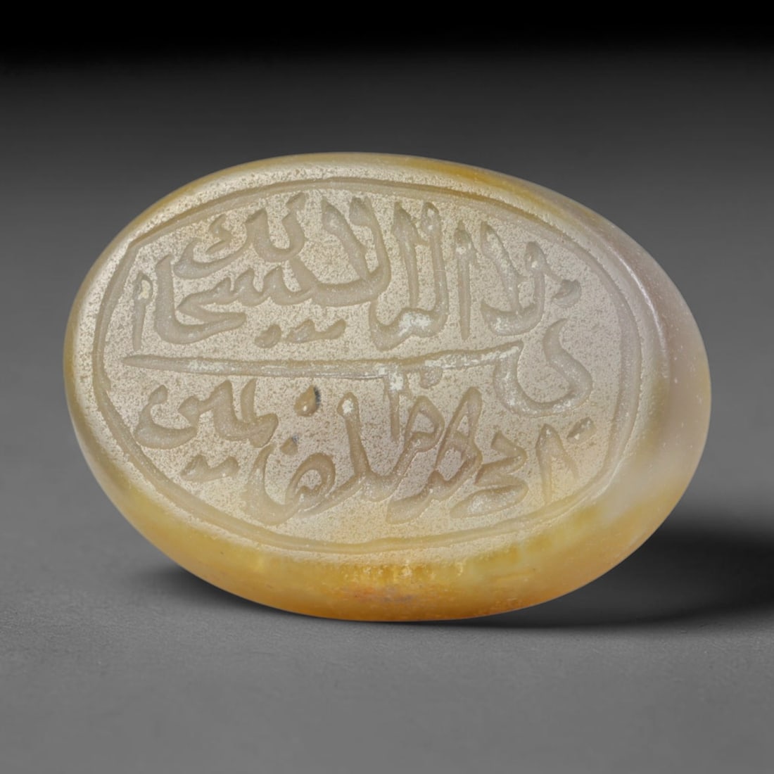 Antique Islamic Qajar / Late Ottoman Agate Calligraphic Talisman Seal (1700-1900 CE), 88FP: Genuine fully hand-carved oval agate seal, entirely crafted by hand without machine tooling, identifiable by organic, uneven hand-cut engraving texture throughout the calligraphic field. The stone bea