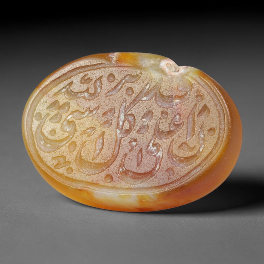 Antique Islamic Qajar / Late Ottoman Agate Calligraphic Talisman Seal (1700-1900 CE), 84FP: Genuine fully hand-carved oval agate seal, entirely crafted by hand without machine tooling, identifiable by organic, uneven hand-cut engraving texture throughout the calligraphic field. The stone bea